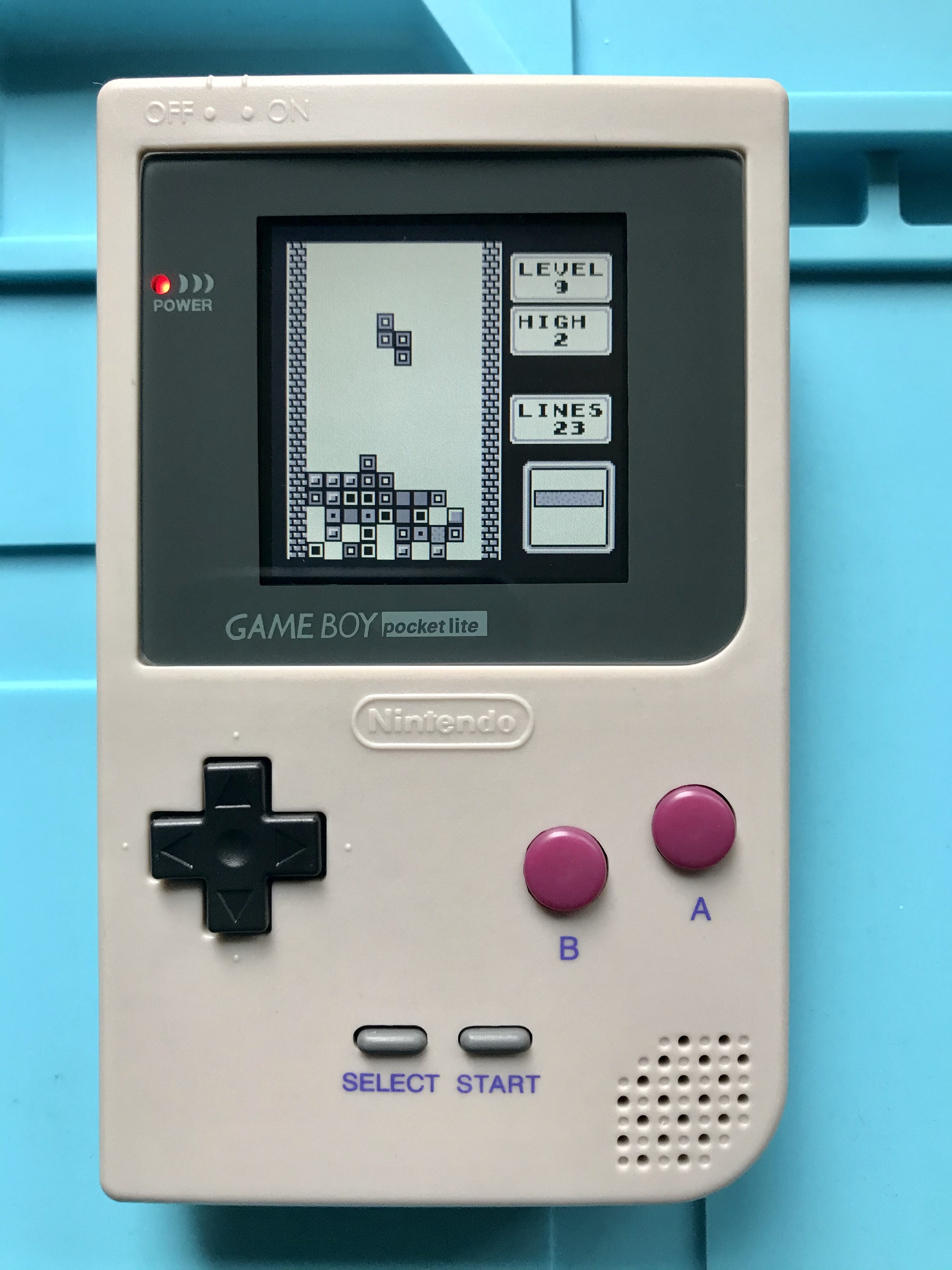 Backlit Game Boy Pocket LCD installed in aftermarket shell