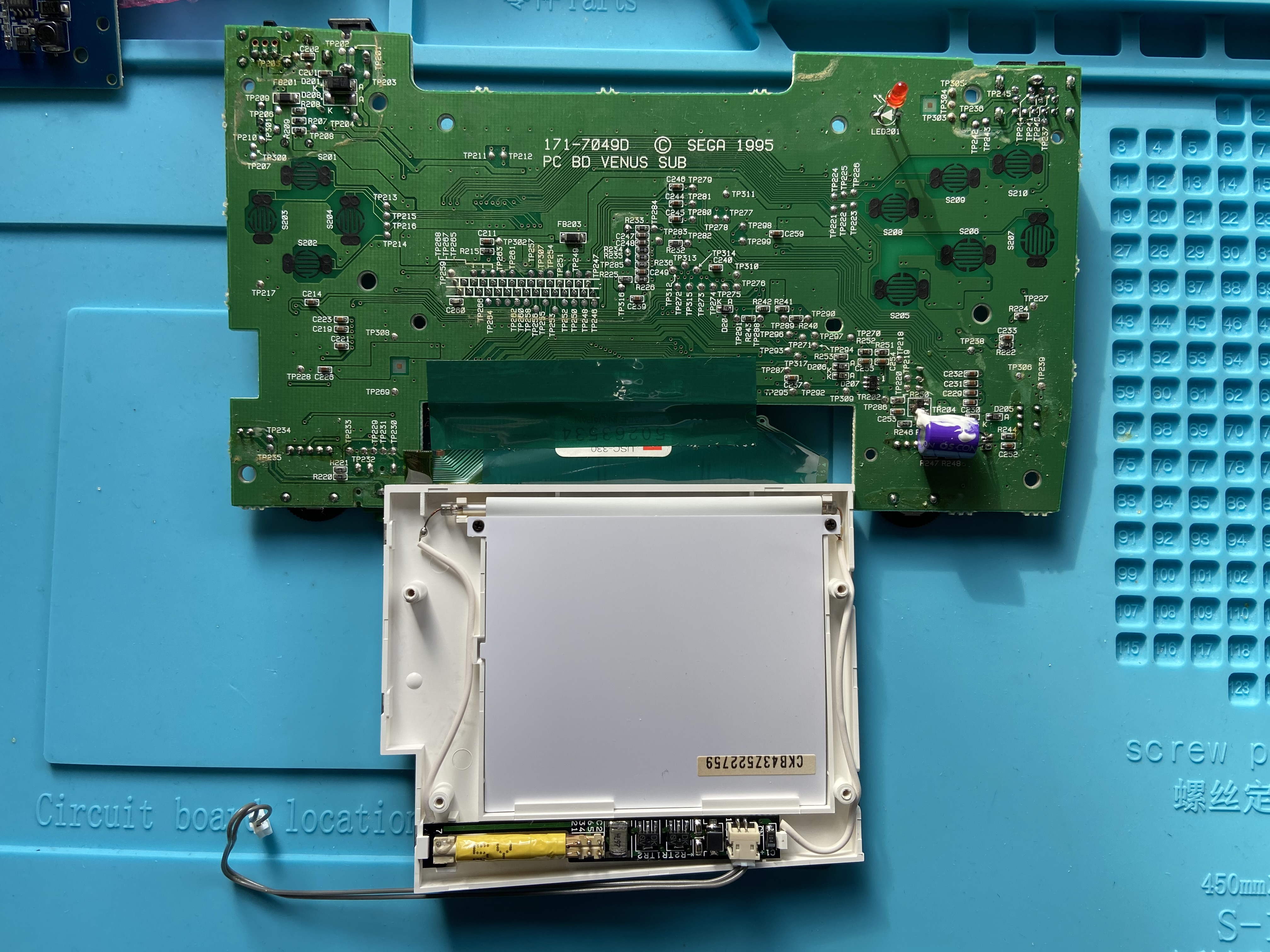 Sega Nomad with stock screen partly removed