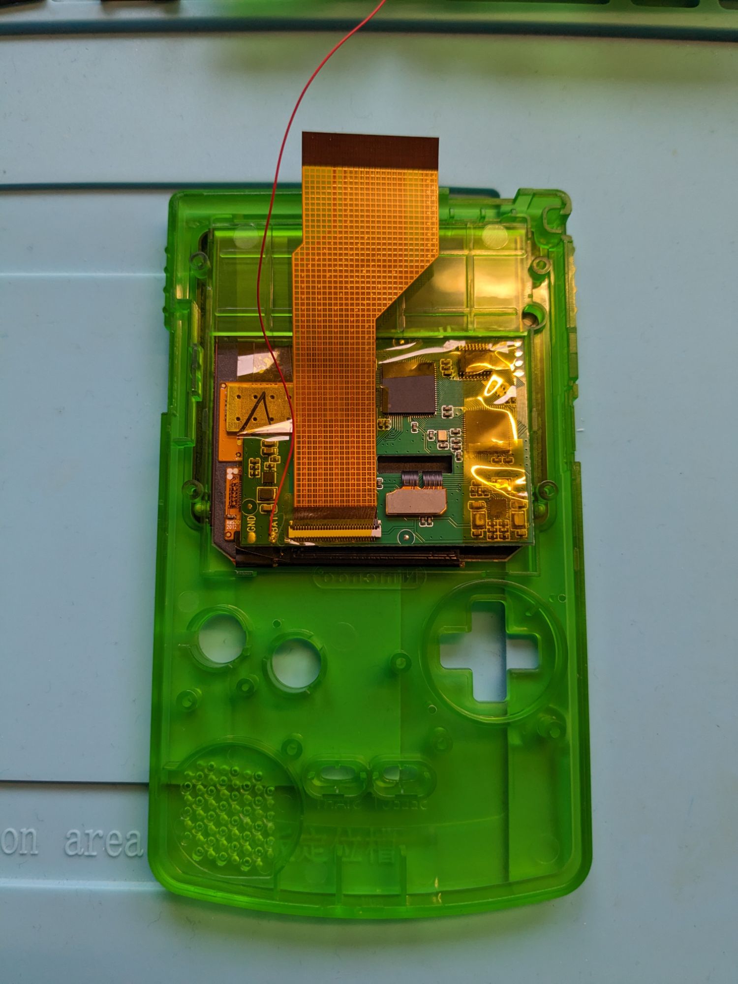 OLED screen kit installed in aftermarket Game Boy Colour front shell